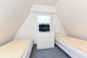 Ein Bett oder Betten in einem Zimmer der Unterkunft Ferienhaus Windspiel