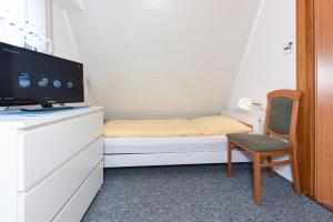 Ein Bett oder Betten in einem Zimmer der Unterkunft Ferienhaus Windspiel