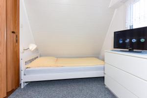 Ein Bett oder Betten in einem Zimmer der Unterkunft Ferienhaus Windspiel