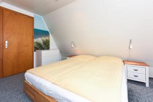 Ein Bett oder Betten in einem Zimmer der Unterkunft Ferienhaus Windspiel