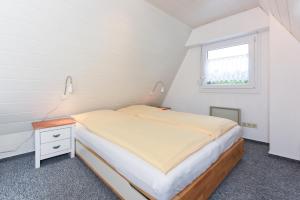 Ein Bett oder Betten in einem Zimmer der Unterkunft Ferienhaus Windspiel