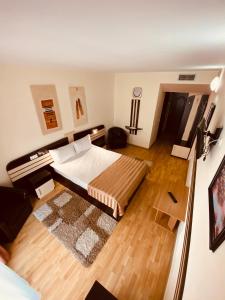 Postel nebo postele na pokoji v ubytování Hotel Zimbru