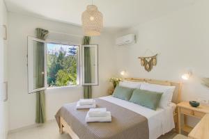 Postel nebo postele na pokoji v ubytování Casa Micallef Corfu
