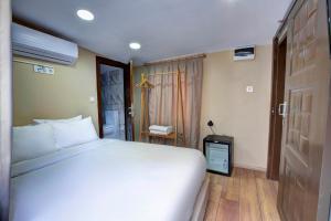 A bed or beds in a room at Maravilloso Hotel Pera