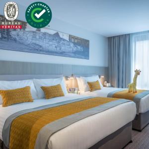 Cama ou camas em um quarto em Maldron Hotel Smithfield Dublin City