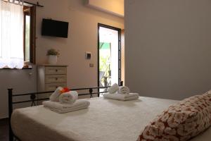 A bed or beds in a room at Villa Rosada