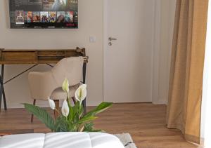 a living room with a couch and a chair at Cimo da Vinha - Nature Spot in Castelo de Paiva