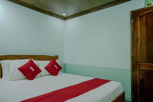 Cama o camas de una habitación en OYO 760 Tiptop Vacation Homes