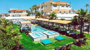 an aerial view of a resort with a swimming pool at Philoxenia Hotel & SPA in Malia