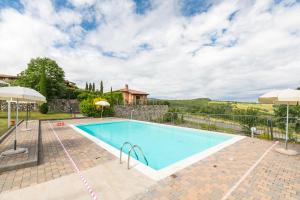 a swimming pool in a villa with a view at Sweet Home Contignano in Contignano
