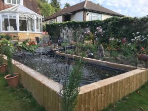 a pond in the backyard of a house at Helens Cottage Otford Kent in Otford