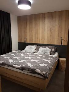 Postel nebo postele na pokoji v ubytování Apartmán Pod Hochfichtem