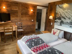 Voodi või voodid majutusasutuse Mountain Lodge Sedrun toas