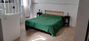 Ein Bett oder Betten in einem Zimmer der Unterkunft Matino Antico Borgo