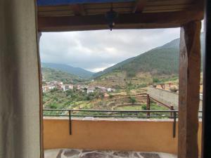 a view from a window of a mountain at Alojamientos Rurales Hurdes Altas - La Antigua Guarderia in Casares de las Hurdes