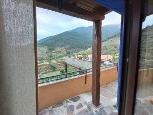 a view from a window of a mountain at Alojamientos Rurales Hurdes Altas - La Antigua Guarderia in Casares de las Hurdes