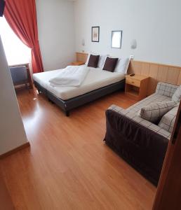 Postel nebo postele na pokoji v ubytování Albergo Dolomiti