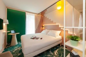 Postel nebo postele na pokoji v ubytování ibis Styles Zurich City Center