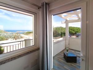 a balcony with a view of the ocean at B&B La Torre Elite in Santa Teresa Gallura