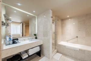 a bathroom with a sink and a tub and a shower at Hotel Intercontinental Medellín, an IHG Hotel in Medellín