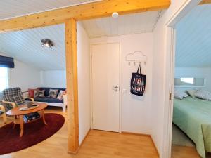 a room with a bed and a table and a door at Ravilac 5 in Kalajoki
