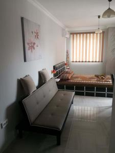 a living room with a couch and a bed at Studio Emi in Pomorie