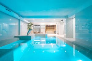 a bath room with a tub and a pool at Innside by Melia Palma Center in Palma de Mallorca