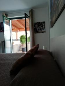 a bedroom with a bed with a large window at Marlen's House in Bernalda +21 photos