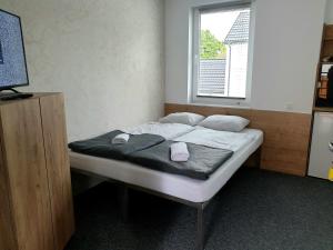 Posteľ alebo postele v izbe v ubytovaní BoomerangHouse