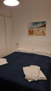Giường trong phòng chung tại A casuzza