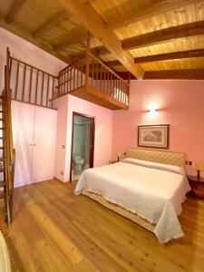 Ένα ή περισσότερα κρεβάτια σε δωμάτιο στο Relais Felciaino B&B