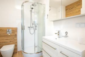 a bathroom with a shower and a toilet at Apartament Future in Kołobrzeg +24 photos