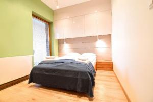 Posteľ alebo postele v izbe v ubytovaní ApartmentPrestige Central Station