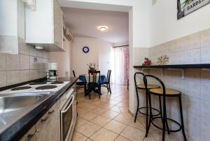 a kitchen with a sink and a counter top at Adrijana in Krk