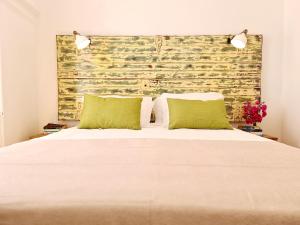 Ένα ή περισσότερα κρεβάτια σε δωμάτιο στο Casa Lara by HnM