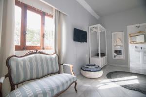 Televízia a/alebo spoločenská miestnosť v ubytovaní Villa Dora (Only adults)