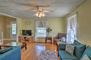 a living room with a couch and a ceiling fan at Pet-Friendly Finger Lakes Home Near Wineries! in Ovid