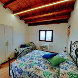 A bed or beds in a room at Terrazza del Golfo