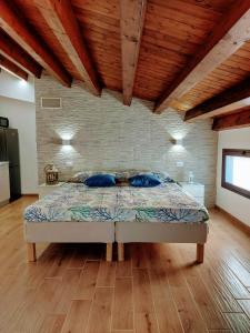 A bed or beds in a room at Terrazza del Golfo