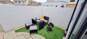 an aerial view of a patio with a table and chairs at Cosy Cottage in Gainford