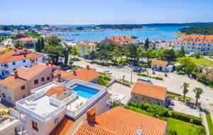 an aerial view of a house with a swimming pool at Villa San Rocco Bed & Breakfast in Medulin