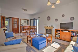 a living room with a couch and a table at Villa Candida by Villa Plus in Vale do Lobo