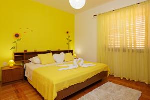 Postel nebo postele na pokoji v ubytování Apartman Miranda
