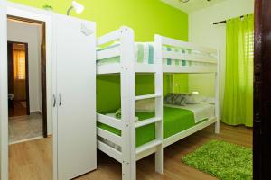Postel nebo postele na pokoji v ubytování Apartman Miranda