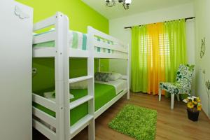 Postel nebo postele na pokoji v ubytování Apartman Miranda
