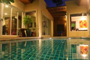 a swimming pool in a house at Karon Beach Walk Villa in Karon Beach