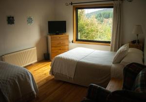 Postel nebo postele na pokoji v ubytování El Reloj Hotel