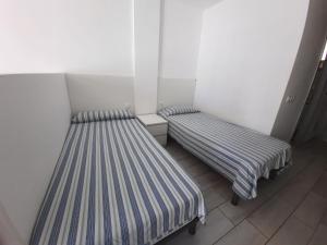 Cama o camas de una habitación en Estudio Edificio El Dorado