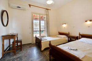 Postel nebo postele na pokoji v ubytování Adonis Apartments