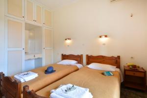 Postel nebo postele na pokoji v ubytování Adonis Apartments